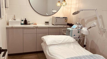 Modern treatment room at Lavina Beauty, Hampton, Victoria, AU, featuring facial equipment and a calming ambiance.
