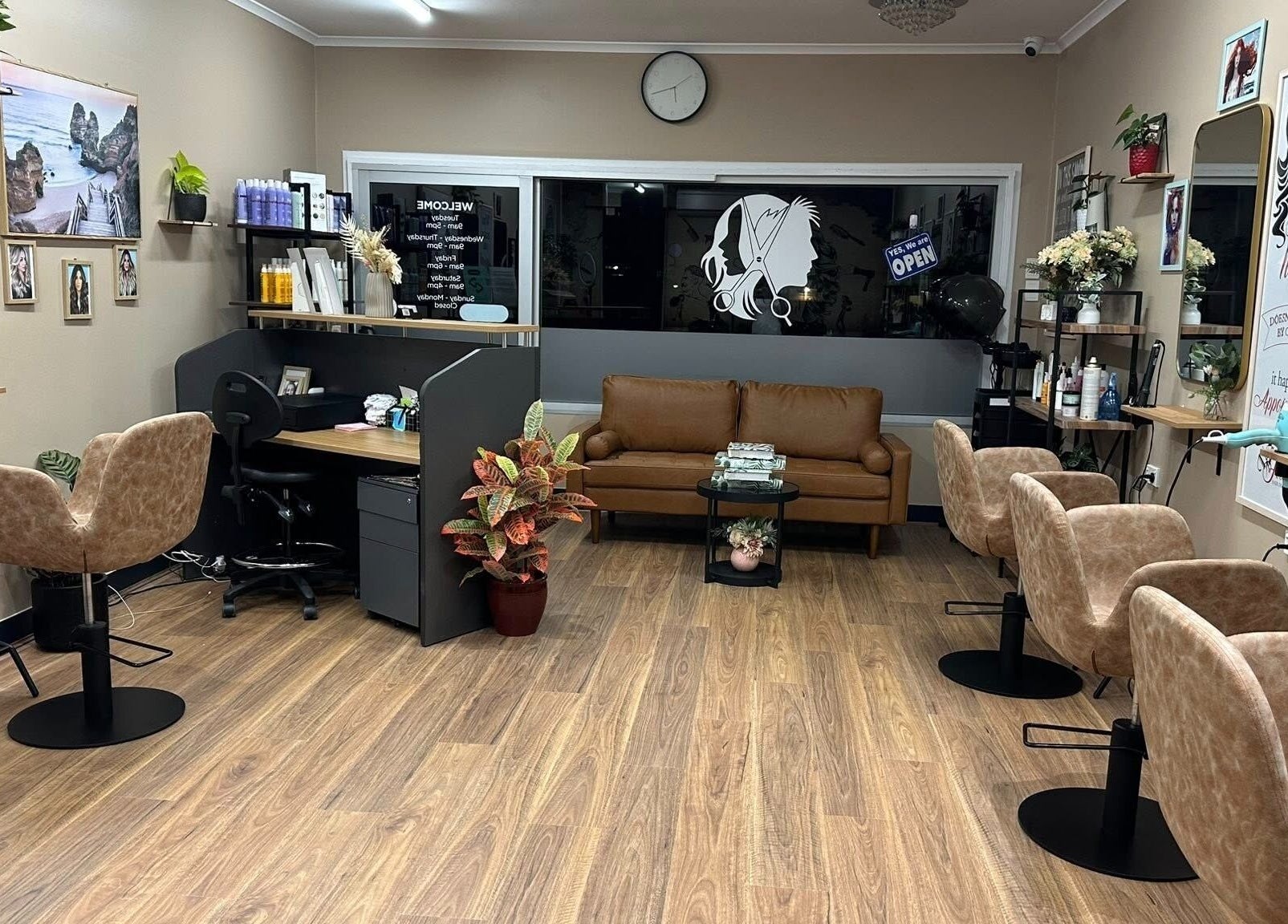 Cozy interior of Flosky Hair Design in Strathpine, Queensland, AU, featuring plush seating and elegant decor.