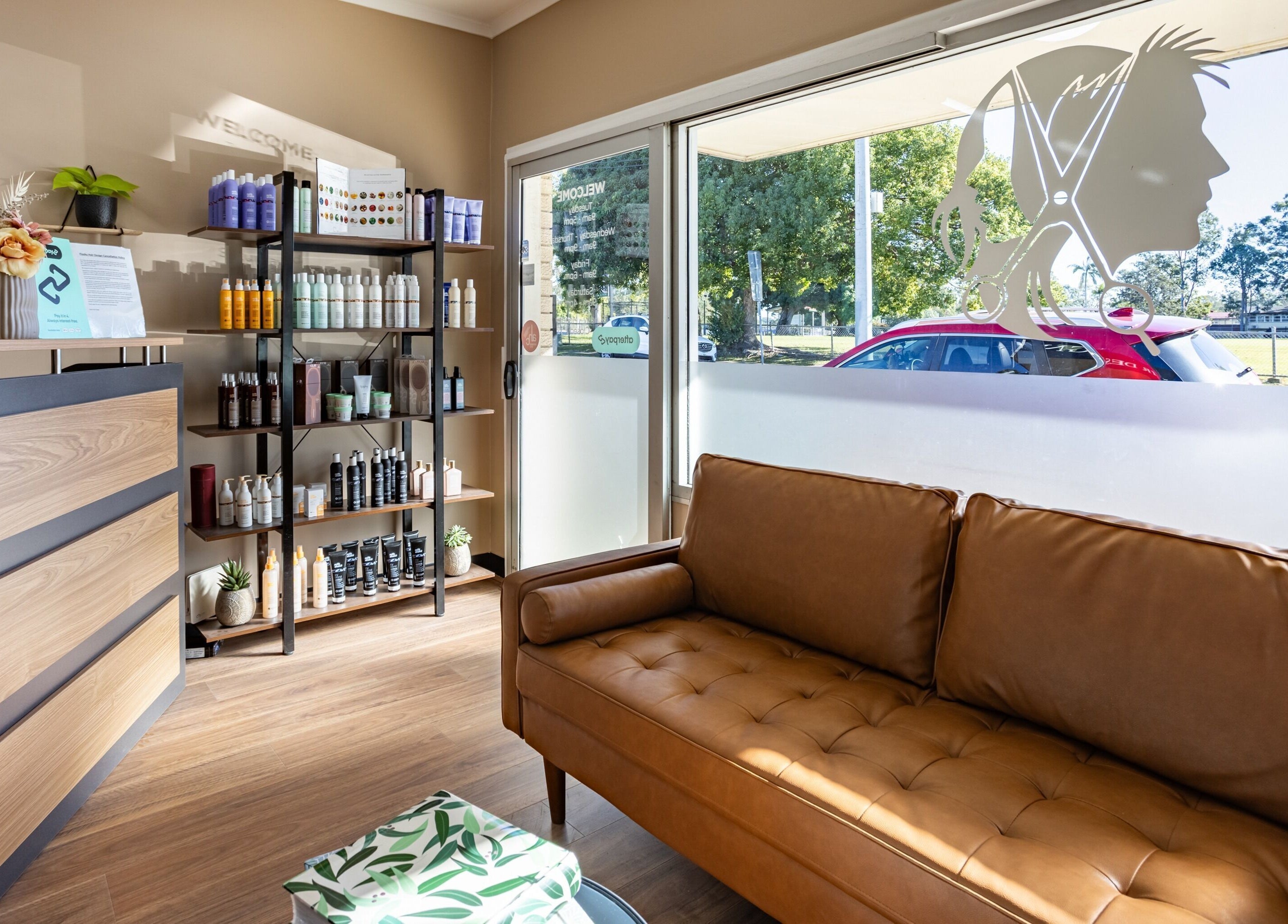 Welcoming Flosky Hair Design entrance lounge in Strathpine, Queensland, AU with modern decor and hair products.