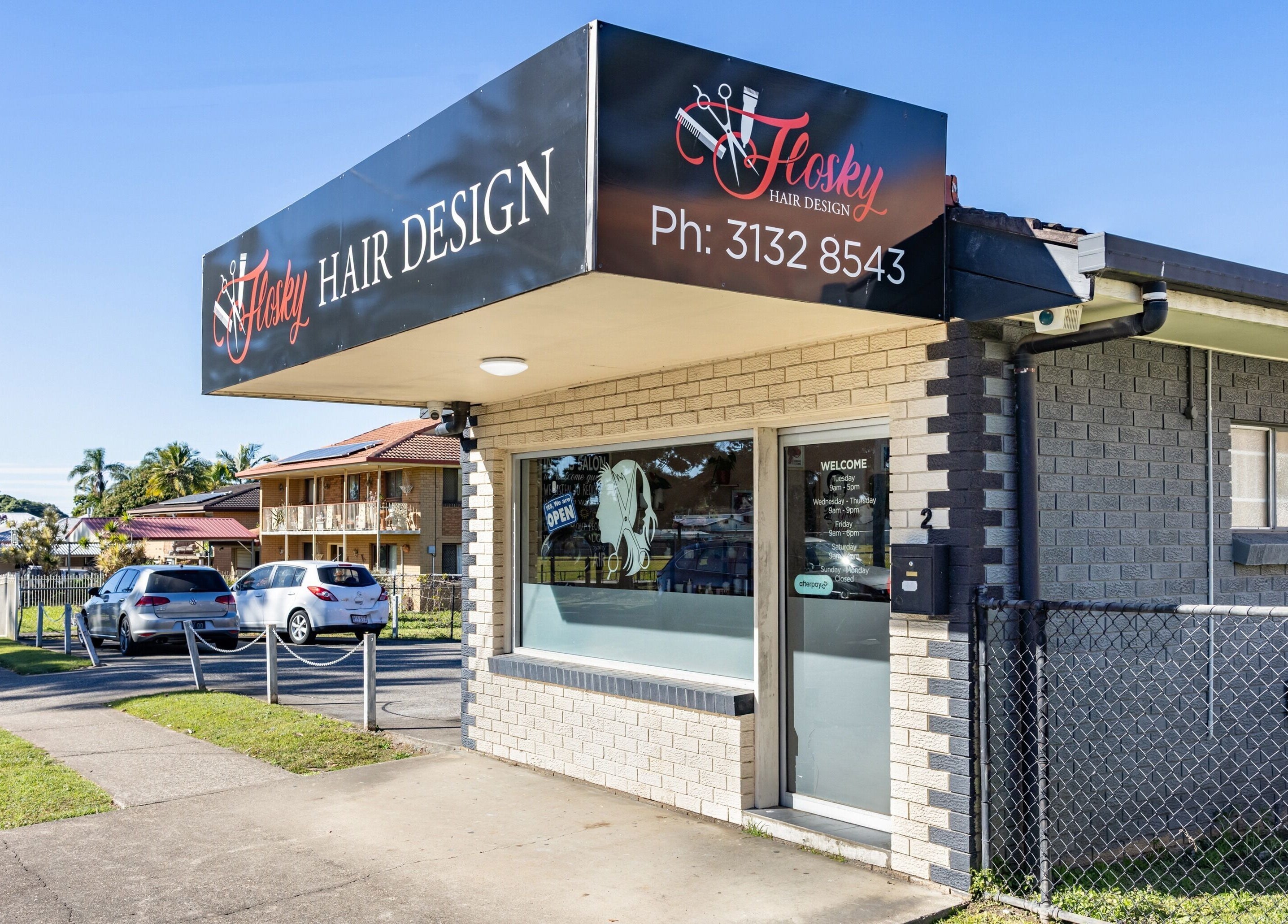 Exterior view of Flosky Hair Design salon in Strathpine, Queensland, AU with clear signage.