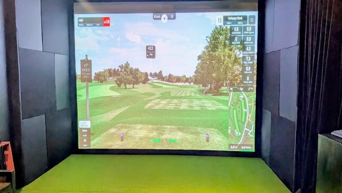 Virtual golf simulator at The 19th Hole, Bali, Bali, ID showing a serene golf course landscape.