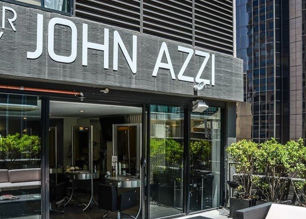 Exterior view of John Azzi Hairdressers located in Sydney, New South Wales, AU with modern design and greenery.