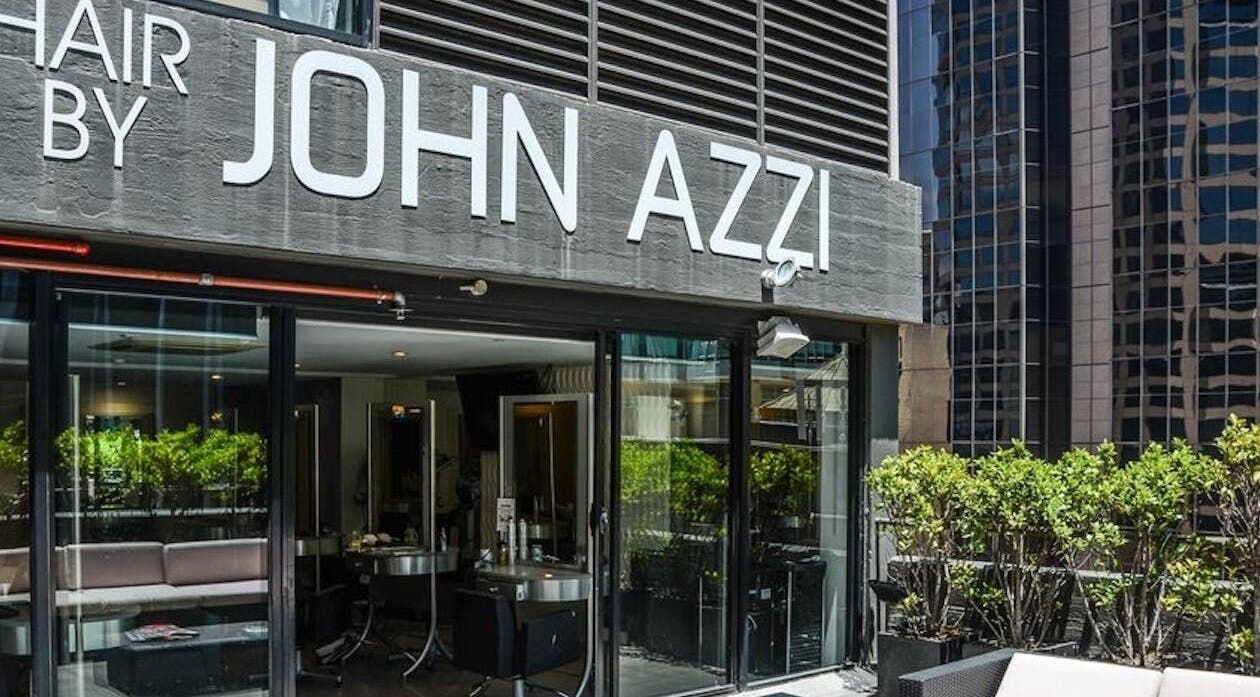 Exterior view of John Azzi Hairdressers located in Sydney, New South Wales, AU with modern design and greenery.