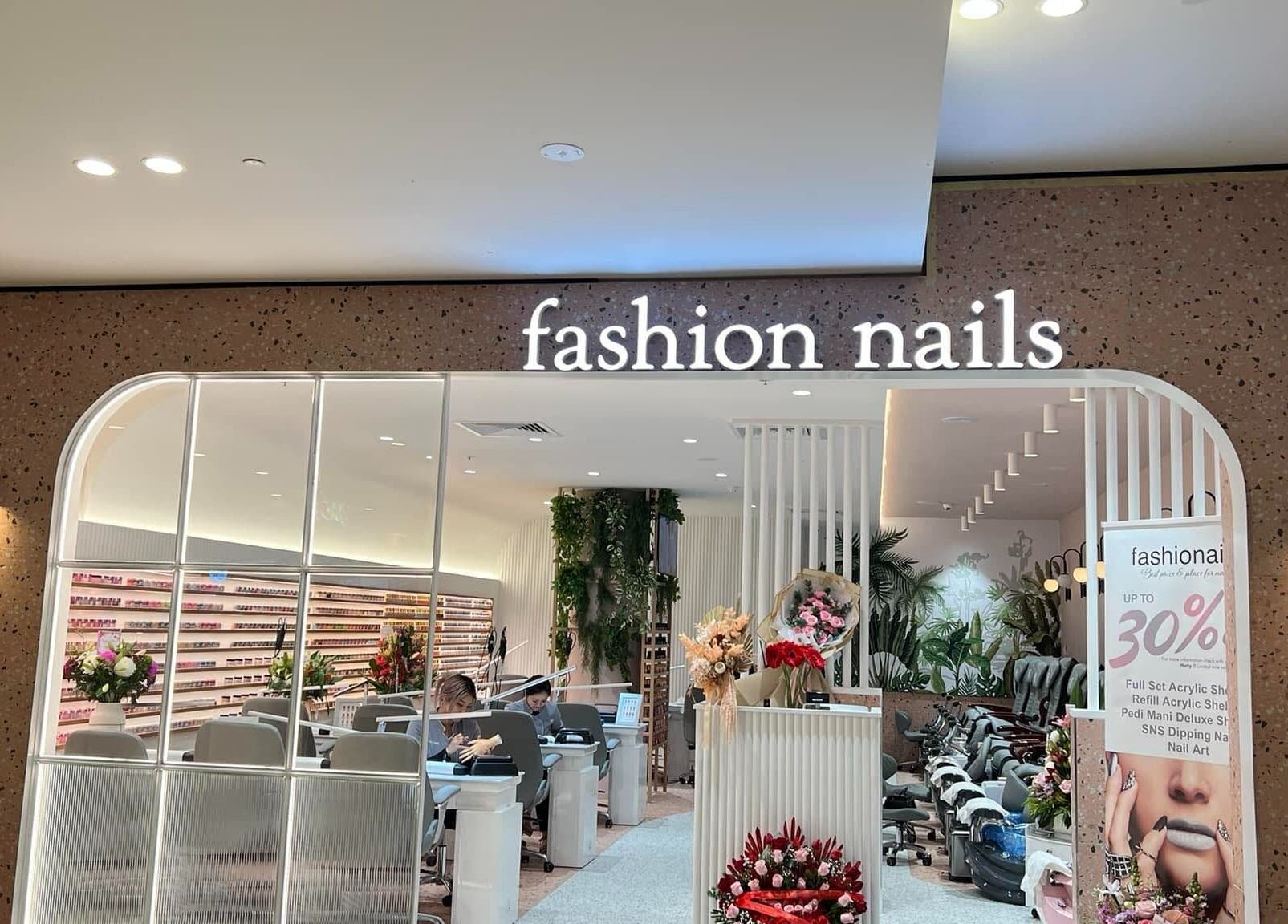 Entrance of Fashion Nails & Beauty in Oaklands Park, South Australia, showcasing modern interior and nail service stations.