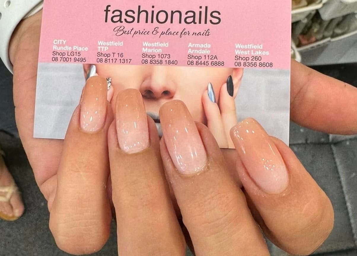 Elegant manicure at Fashion Nails Rundle Place, Adelaide, South Australia, AU showcases glossy nail art.