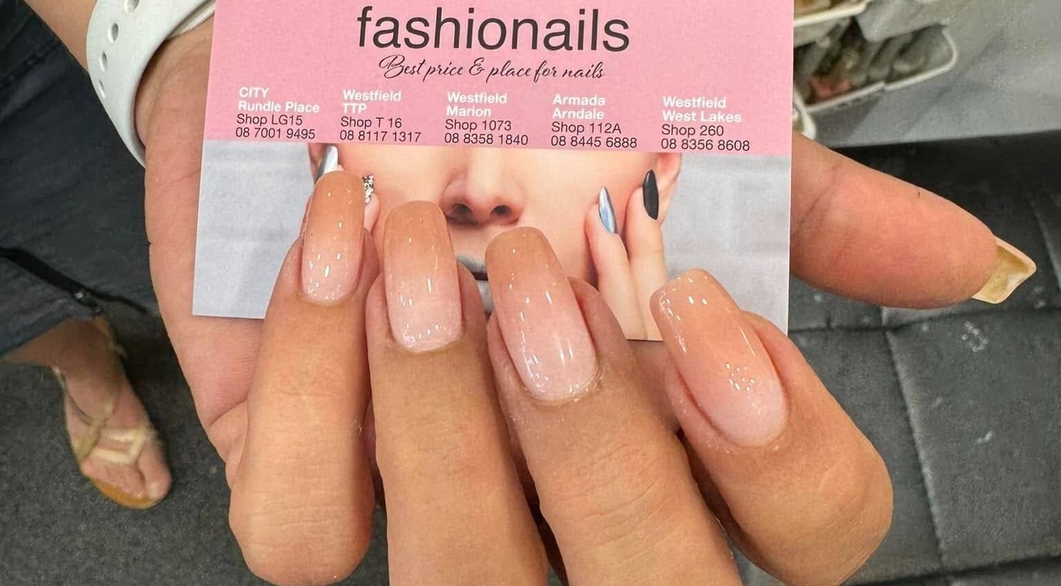 Elegant manicure at Fashion Nails Rundle Place, Adelaide, South Australia, AU showcases glossy nail art.