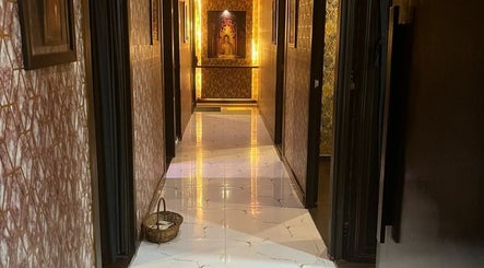 Elegant hallway at The SOFITEL wellness, Manikonda, Hyderabad with warm lighting and classic decor.