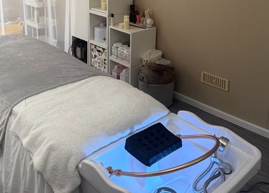 Cozy treatment room at Made Beauty, Nazeing, England, GB featuring a comfortable spa bed.