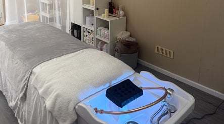 Cozy treatment room at Made Beauty, Nazeing, England, GB featuring a comfortable spa bed.
