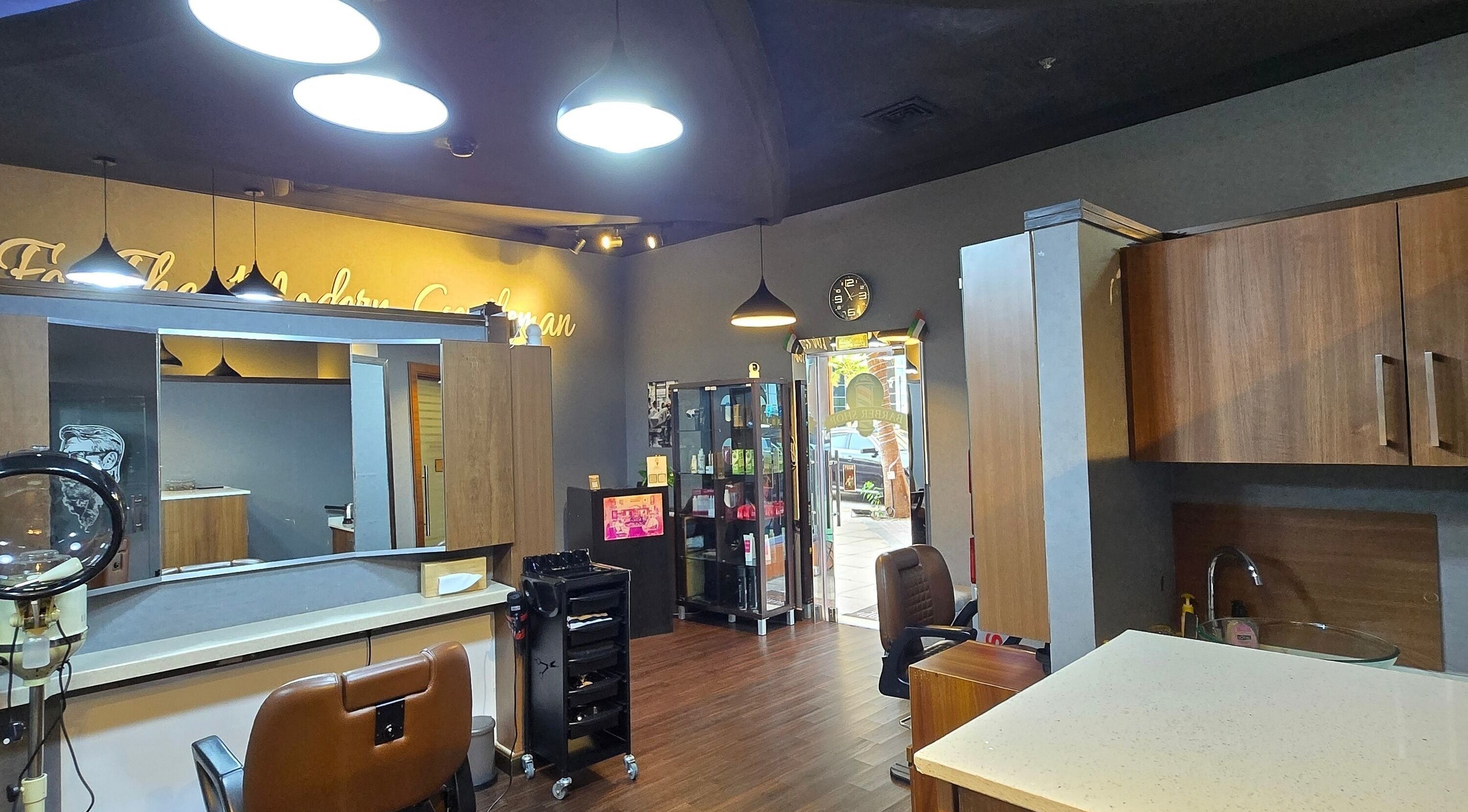 Interior of Figaro Gentleman L.L.C, barber shop in Abu Dhabi, Abu Dhabi, AE with sleek decor and styling stations.