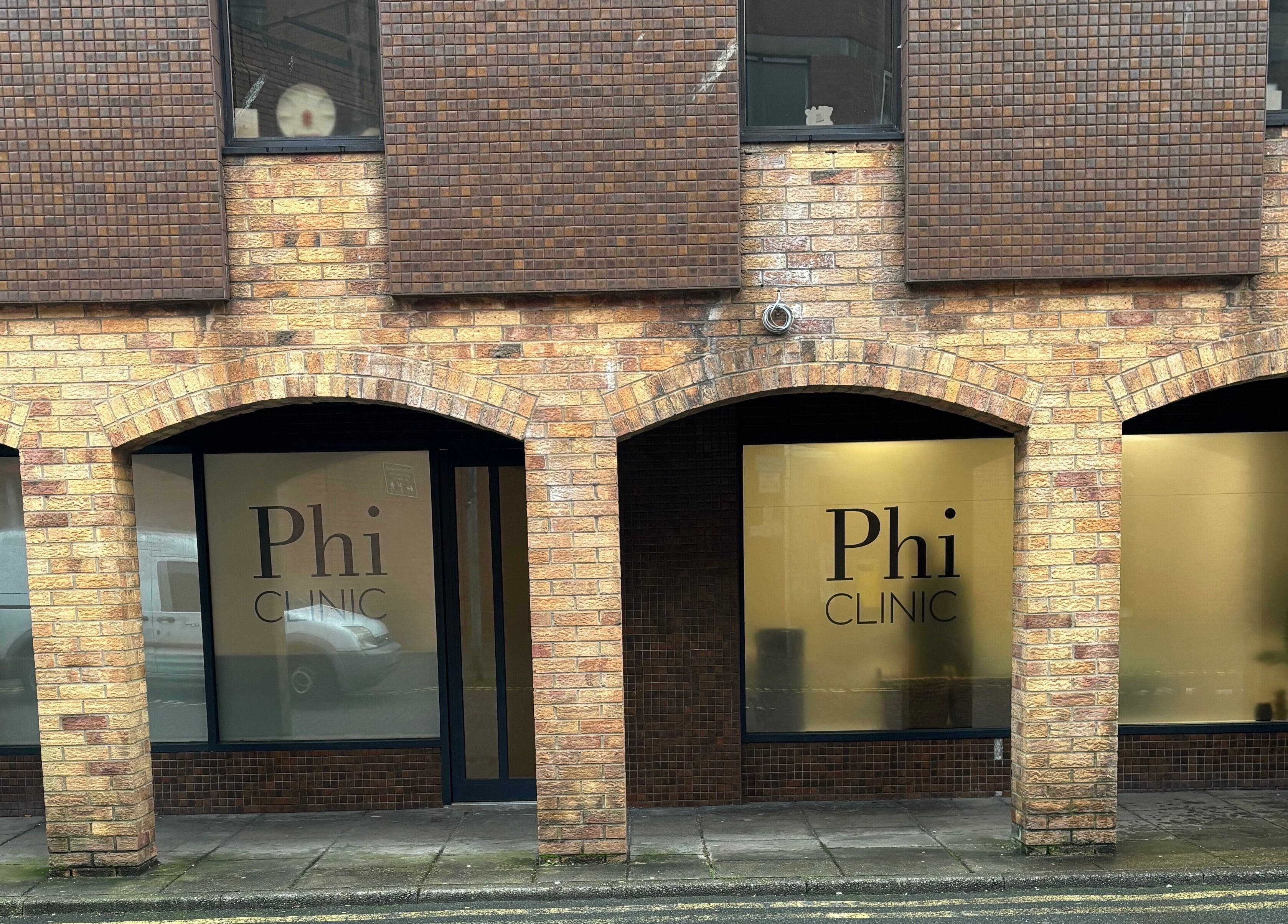Exterior view of Phi Clinic IOM, a beauty venue in Douglas, Isle of Man, GB with brick arches.