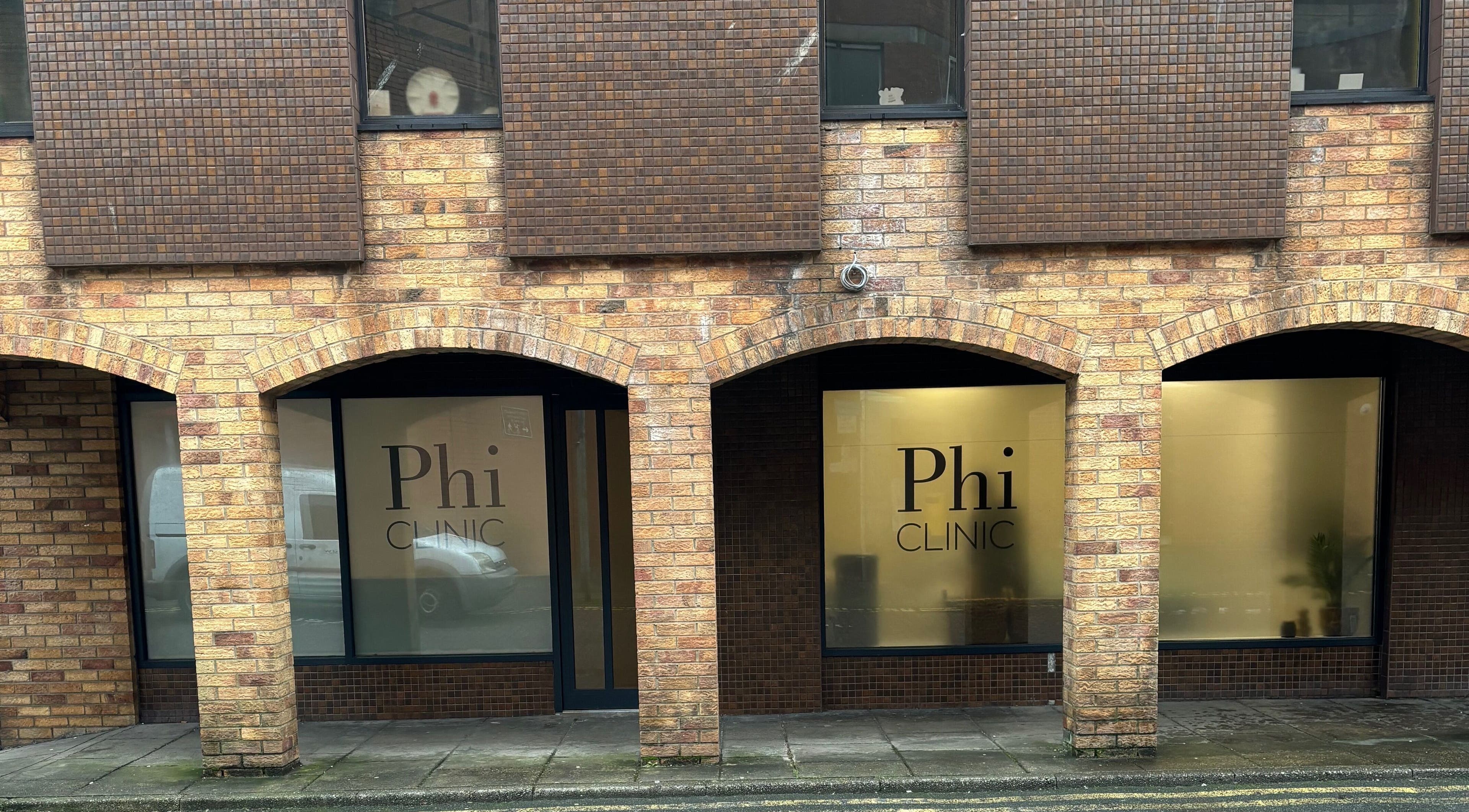Exterior view of Phi Clinic IOM, a beauty venue in Douglas, Isle of Man, GB with brick arches.