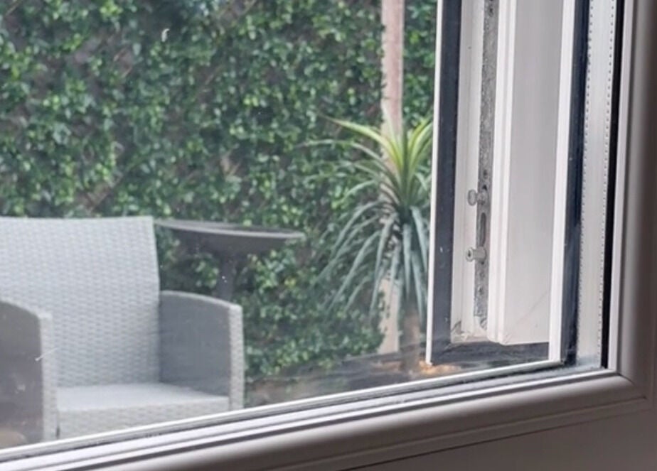 Relaxing garden terrace at Pampered@62, Blackpool, England, GB, featuring a stylish chair and lush greenery.