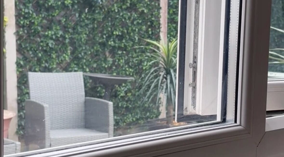 Relaxing garden terrace at Pampered@62, Blackpool, England, GB, featuring a stylish chair and lush greenery.