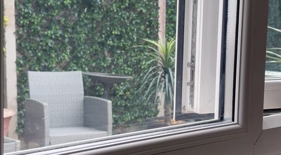 Relaxing garden terrace at Pampered@62, Blackpool, England, GB, featuring a stylish chair and lush greenery.