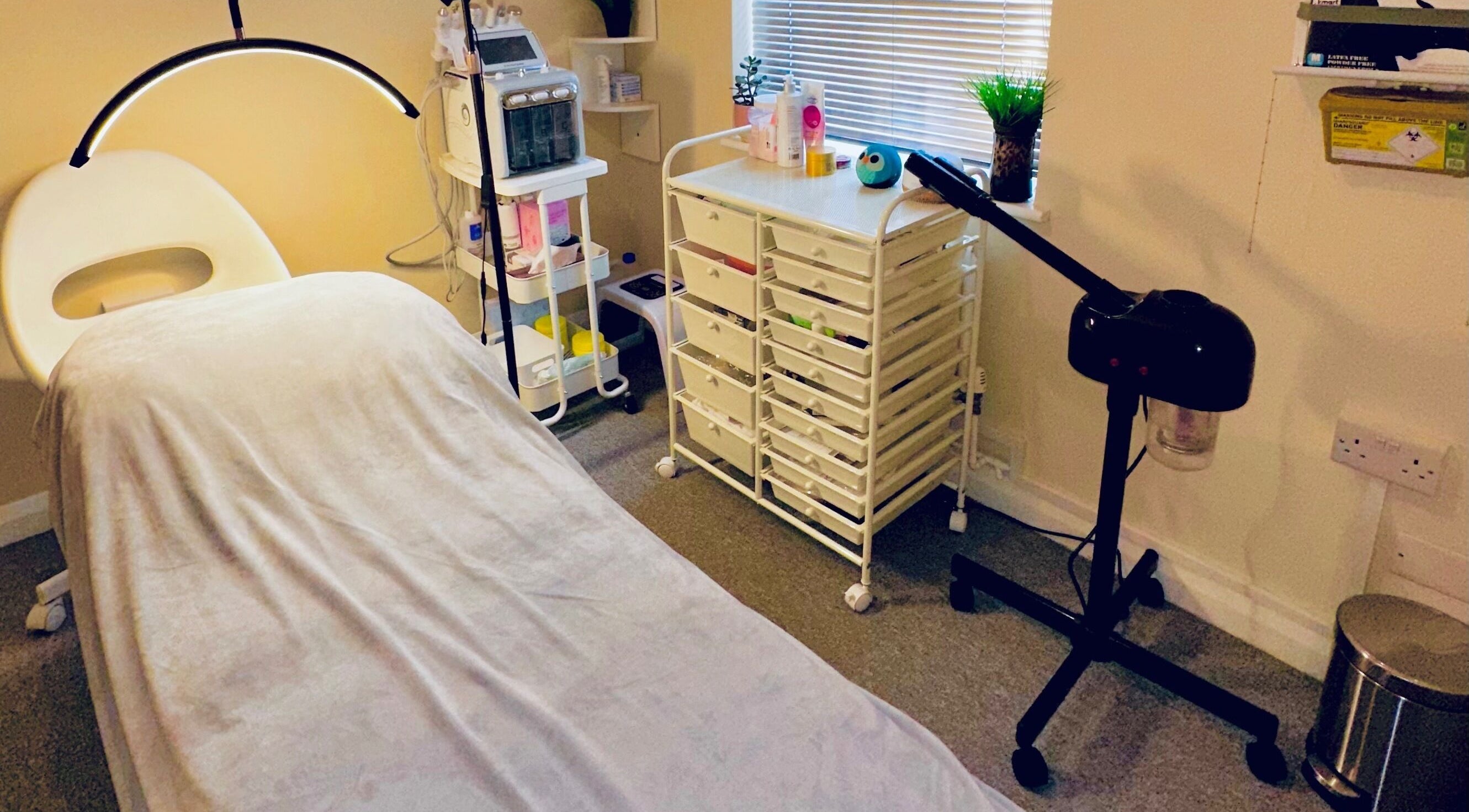 Cozy treatment room at Esthora Aesthetics in London, England, GB equipped for beauty and wellness services.