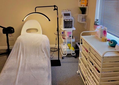 A serene treatment room at Esthora Aesthetics, London, England, GB, with modern equipment and soothing decor.