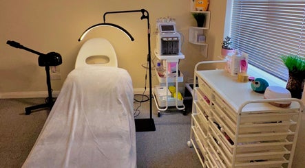 A serene treatment room at Esthora Aesthetics, London, England, GB, with modern equipment and soothing decor.