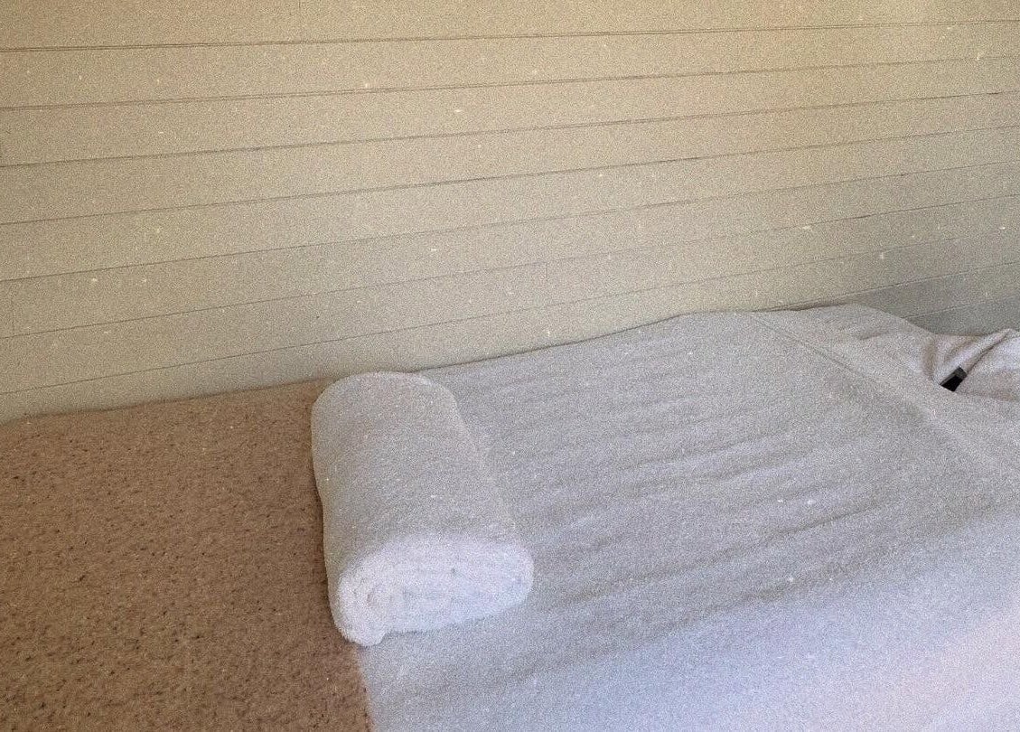 Cozy massage table at Wellness Studio, Bristol, England, GB, ready for a relaxing therapy session.