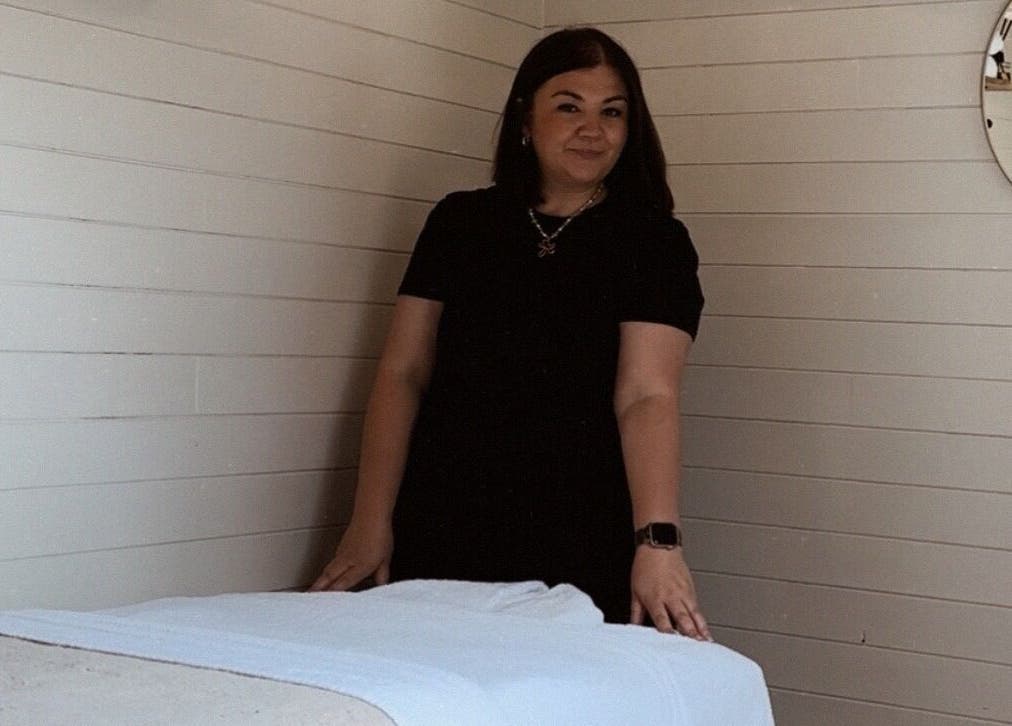 Wellness Studio therapist in serene room, Bristol, England, GB. Relaxing treatment environment.