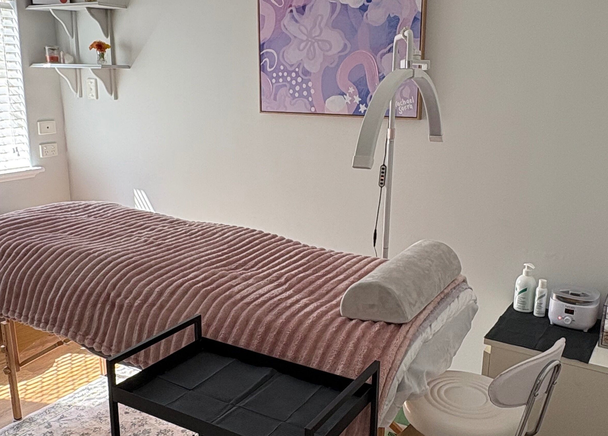 Tranquil treatment room at Eyes by Em, Greenfields, Western Australia, AU, featuring cozy bed and soft lighting.