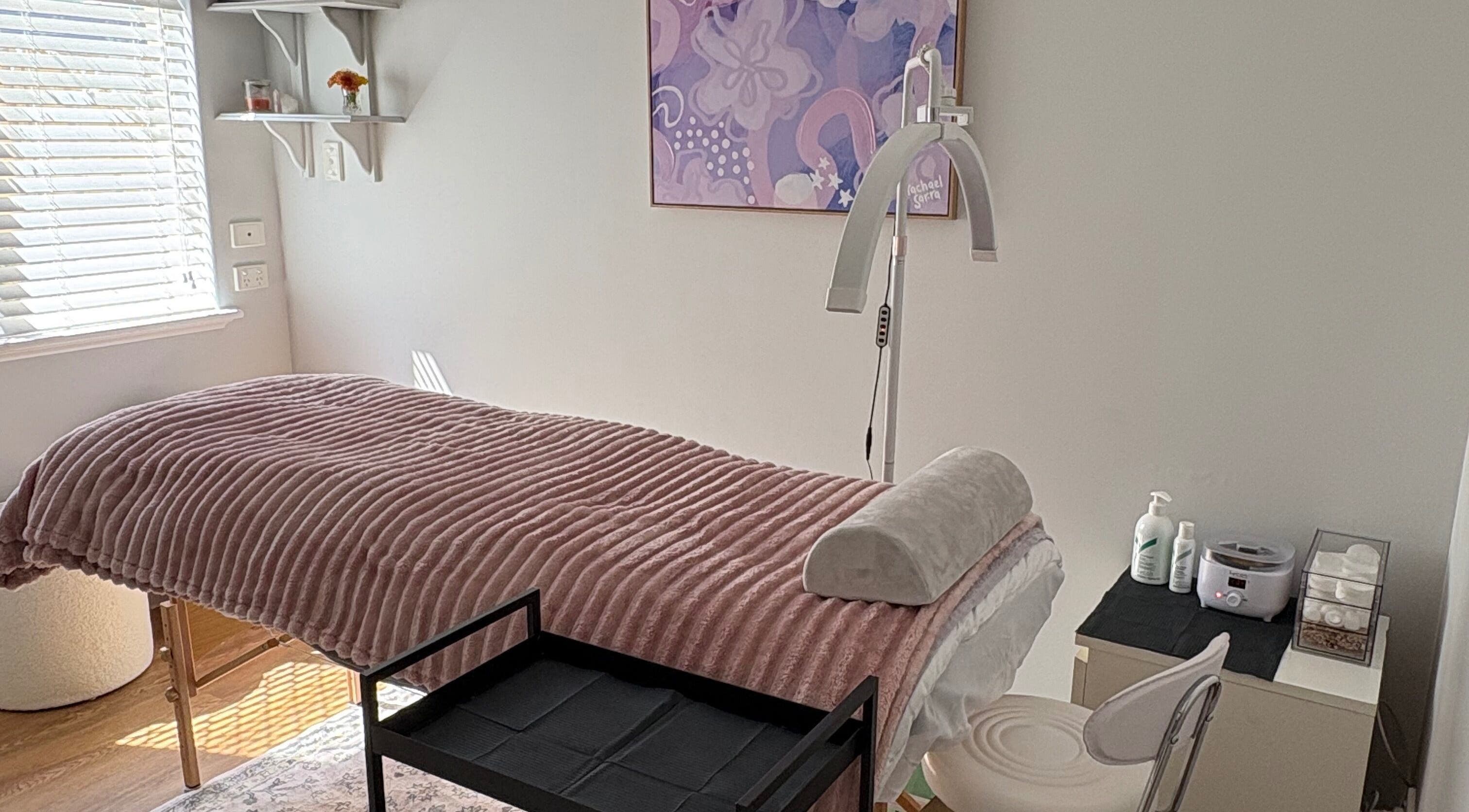 Tranquil treatment room at Eyes by Em, Greenfields, Western Australia, AU, featuring cozy bed and soft lighting.