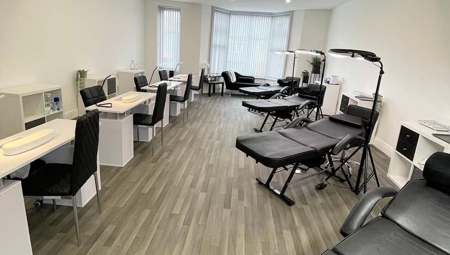 Modern beauty studio at Glammedbyamelia, Plymouth, England, GB with elegant manicure stations and treatment beds.