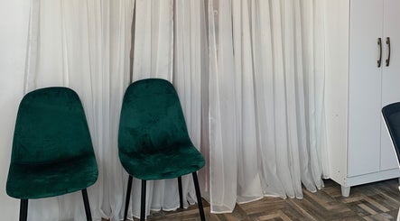 Emerald chairs against white curtains at OnHer by Melissa Studio, Trincity, Tunapuna/piarco Regional Corporation, TT.