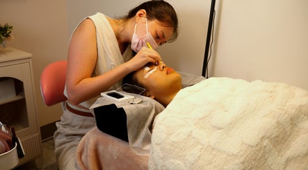 Technician applying lash extensions at PRECISION LASH & BROW, Bethesda, Maryland, US.
