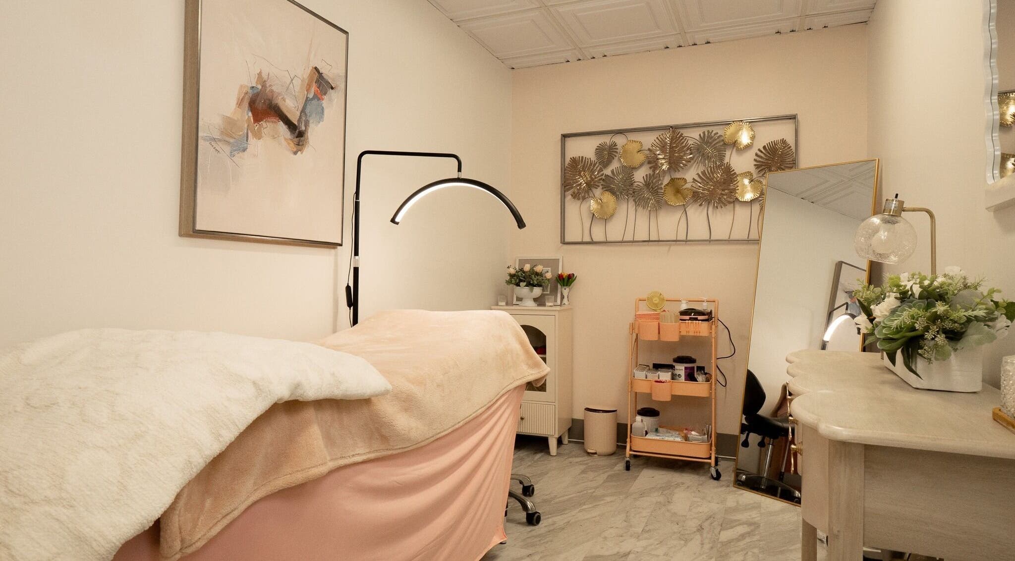 Tranquil treatment room at PRECISION LASH & BROW, Bethesda, Maryland, US, featuring elegant decor and ambient lighting.
