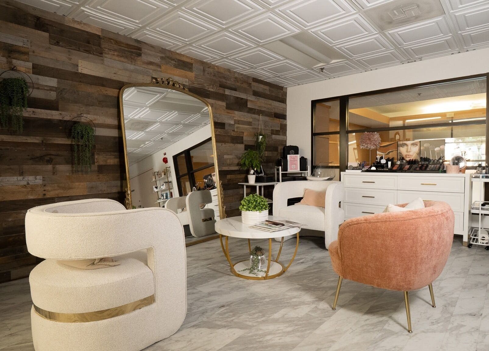 Elegant seating area at PRECISION LASH & BROW, Bethesda, Maryland, US with modern chairs and decor.