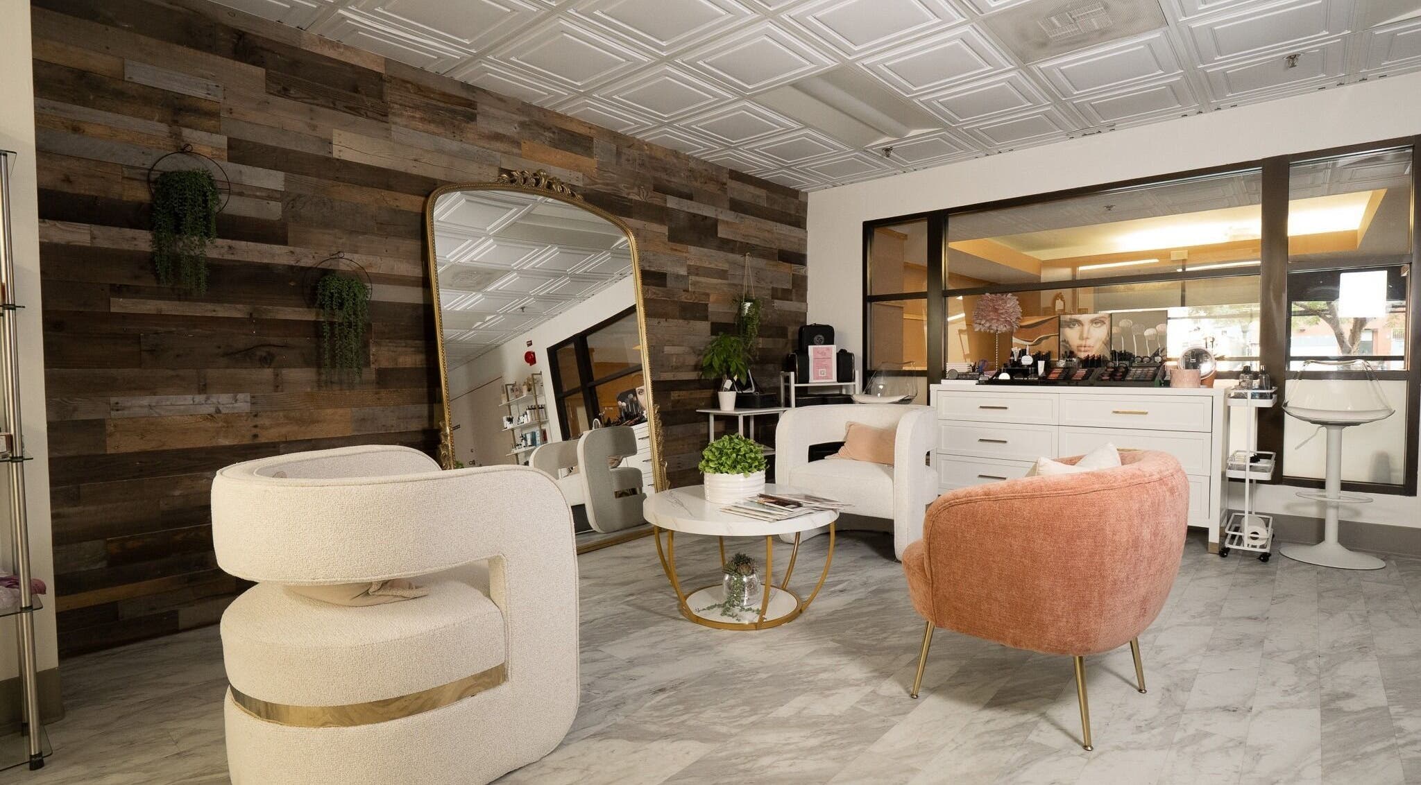 Elegant seating area at PRECISION LASH & BROW, Bethesda, Maryland, US with modern chairs and decor.