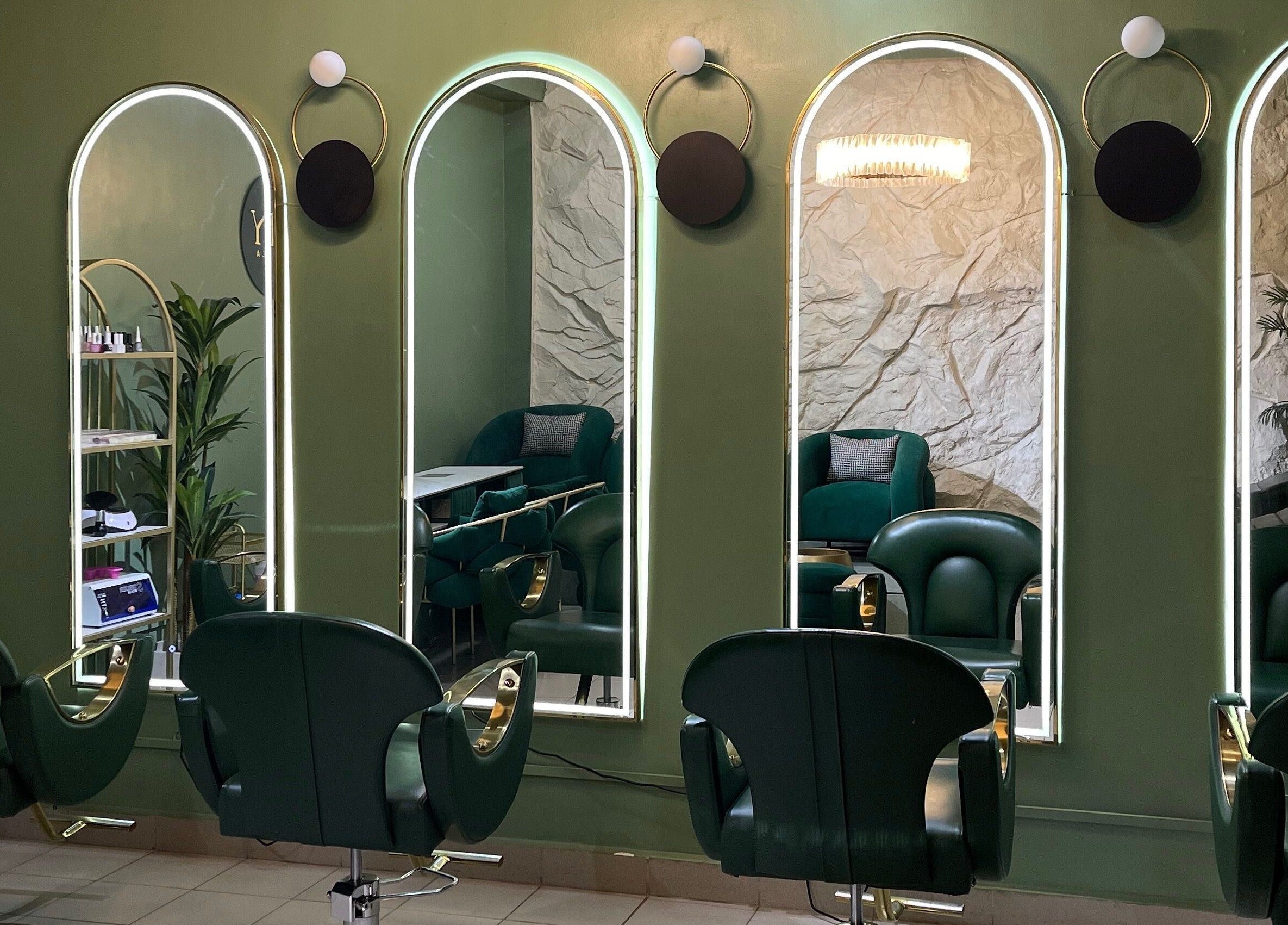 Chic salon interior at SHY KAMPALA BY MB, Kampala, Central Region, UG, showcasing modern styling chairs and mirrors.