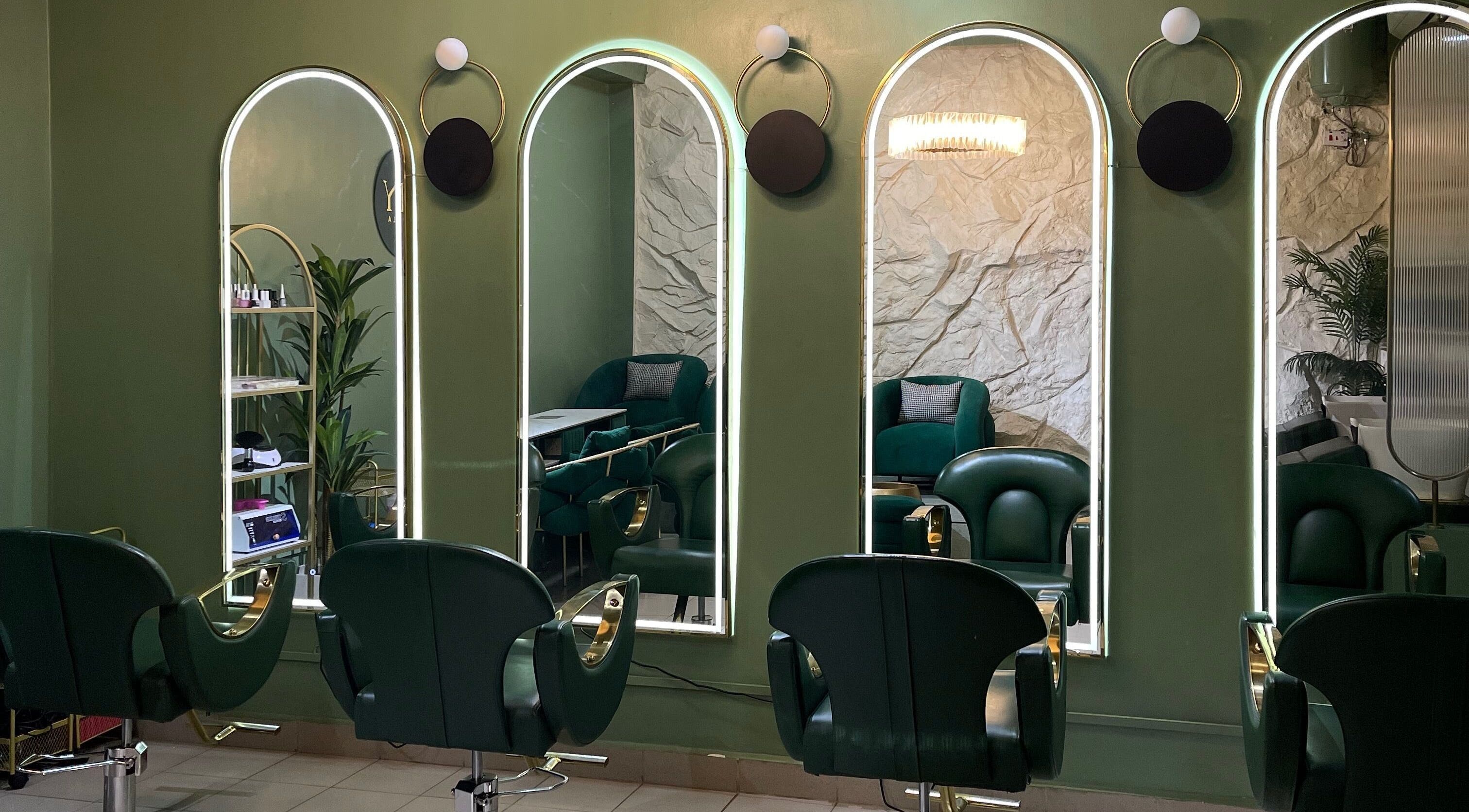 Chic salon interior at SHY KAMPALA BY MB, Kampala, Central Region, UG, showcasing modern styling chairs and mirrors.