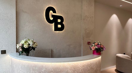 Stylish GB BROWS reception area with floral decor, located in London, England, GB.