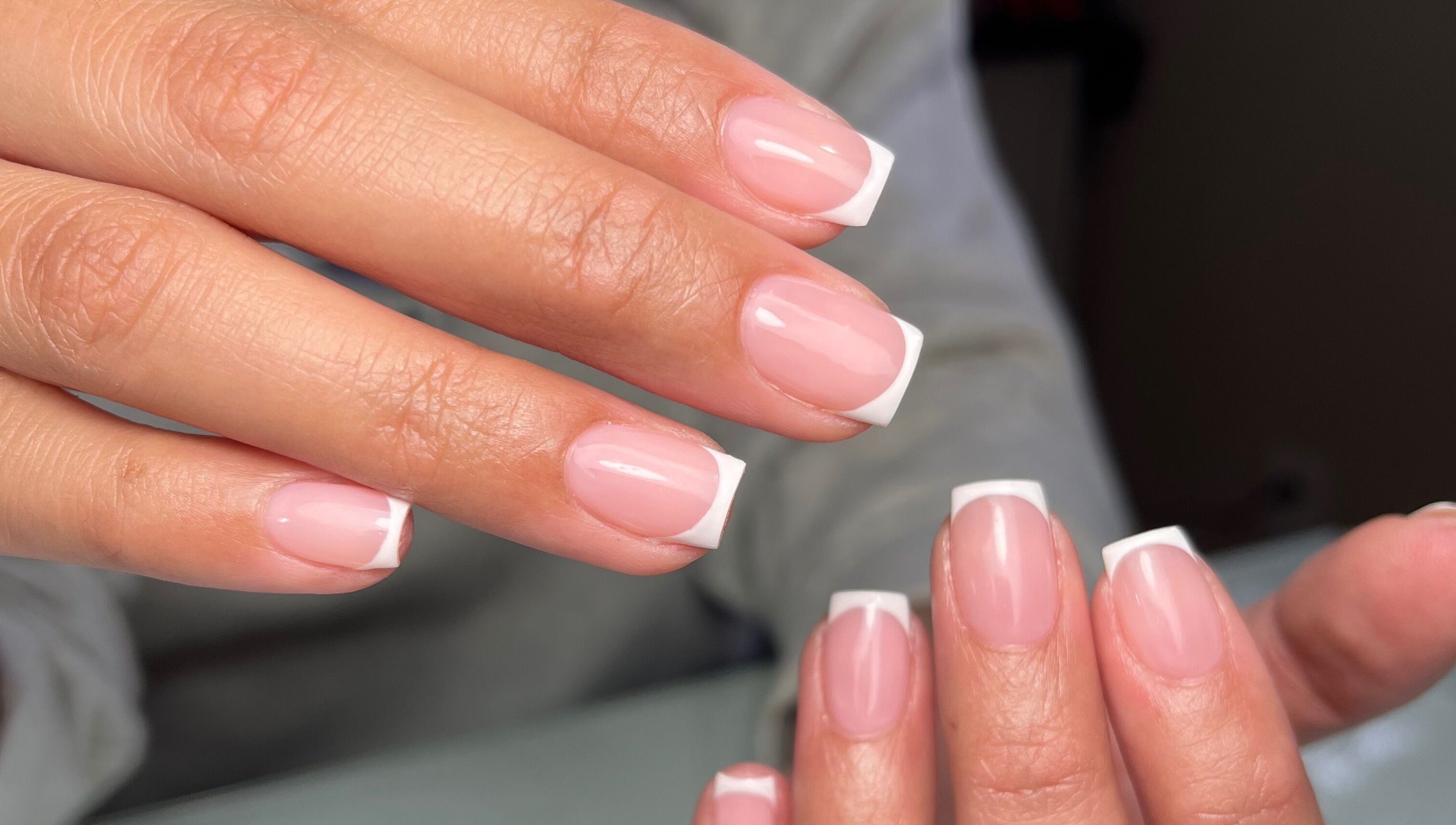 French manicure at Dainty Daggers Salon, Calgary, Alberta, CA. Perfectly polished nails display elegance.
