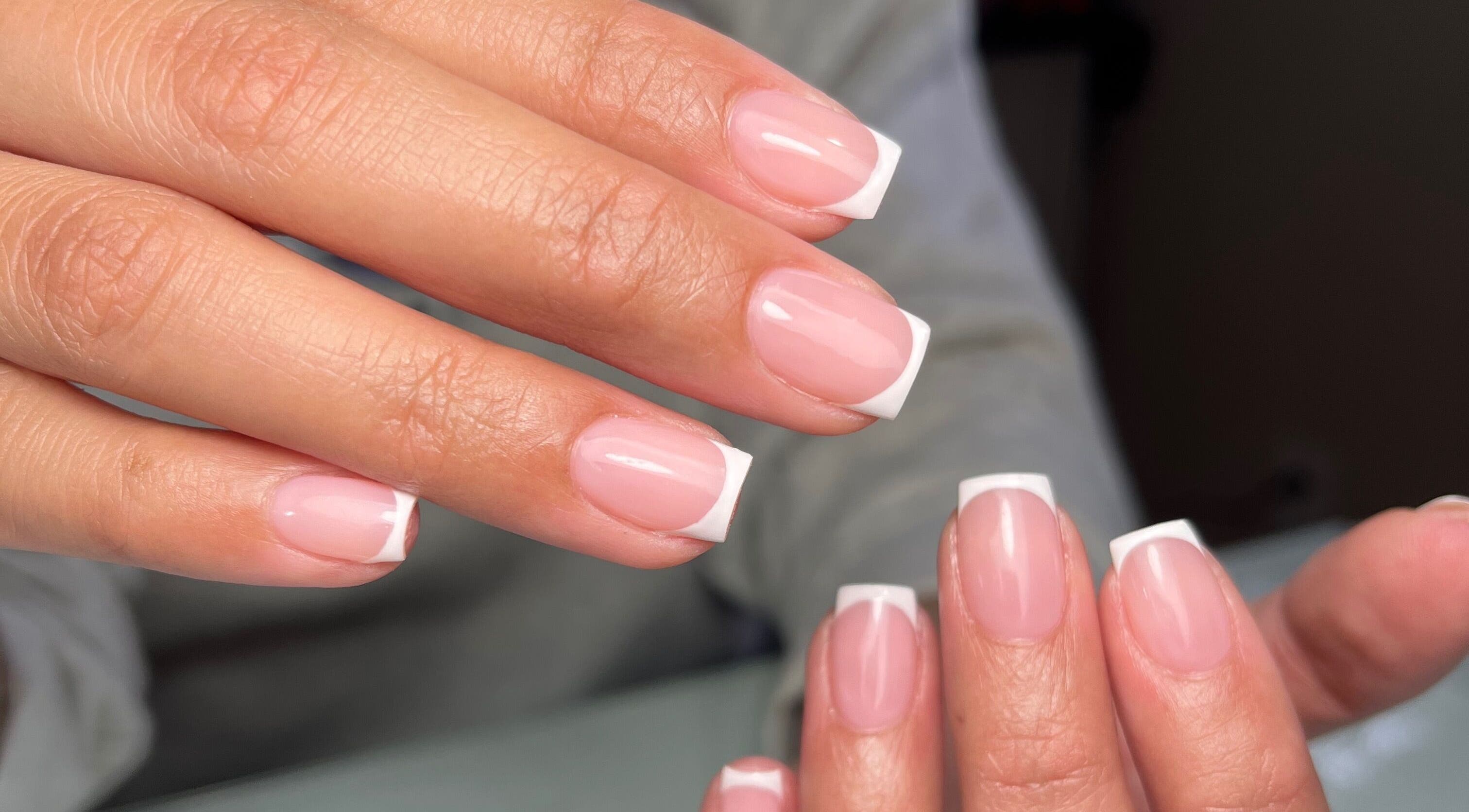 French manicure at Dainty Daggers Salon, Calgary, Alberta, CA. Perfectly polished nails display elegance.