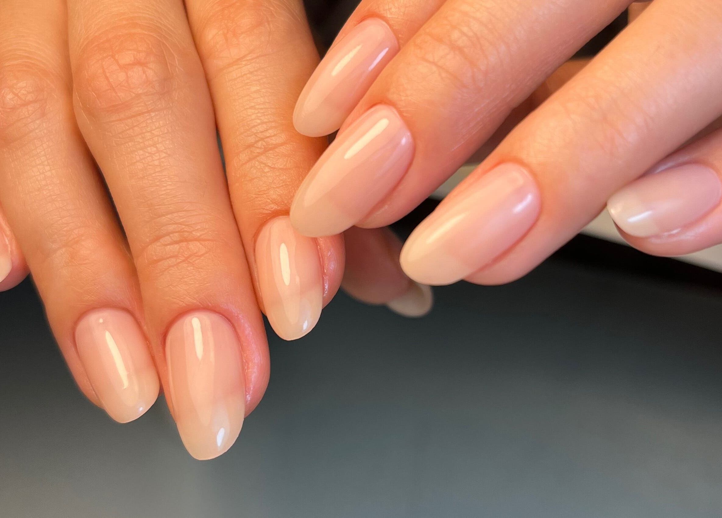 Beautiful manicured nails at Dainty Daggers Salon, Calgary, Alberta, CA showcasing natural nail designs.