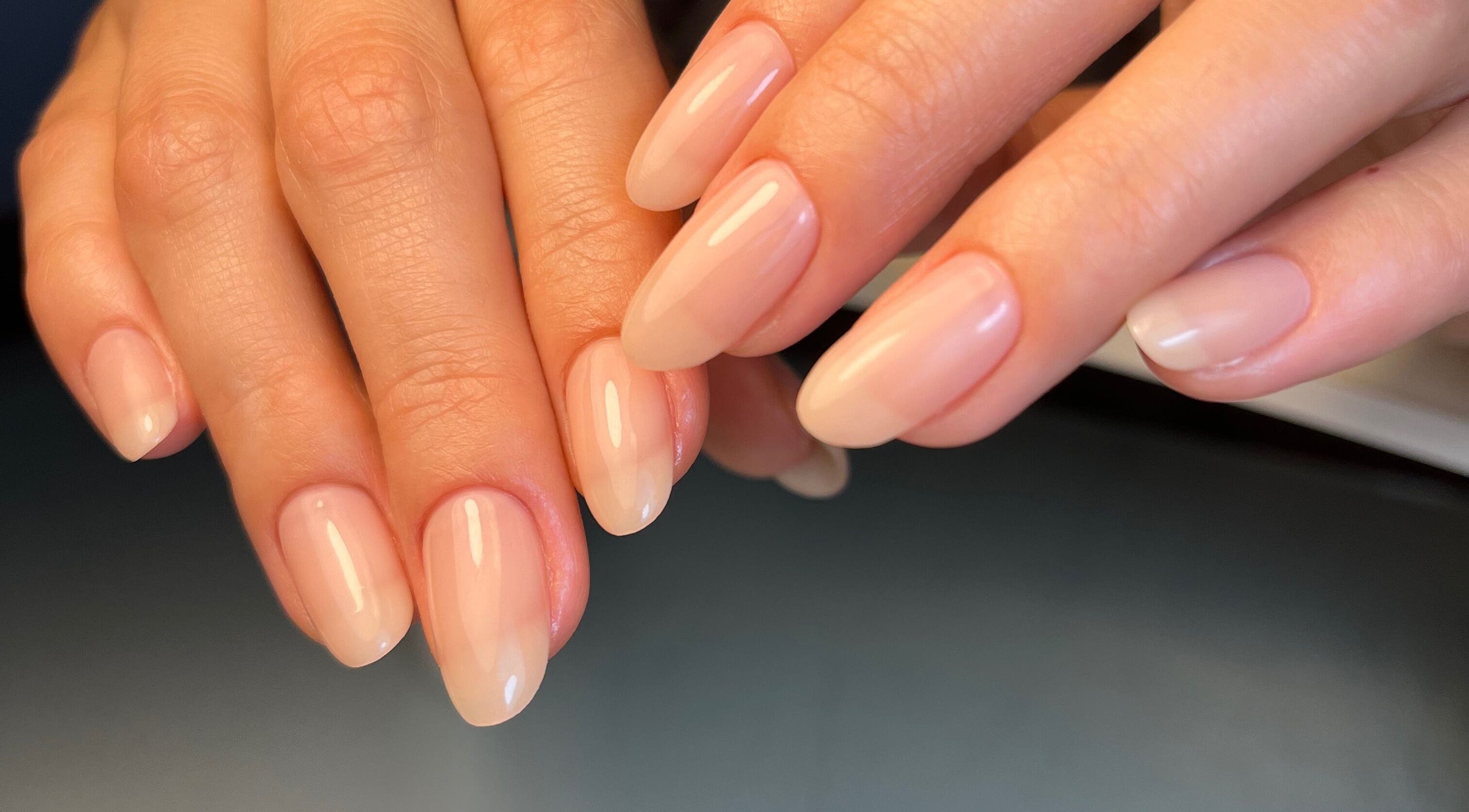 Beautiful manicured nails at Dainty Daggers Salon, Calgary, Alberta, CA showcasing natural nail designs.