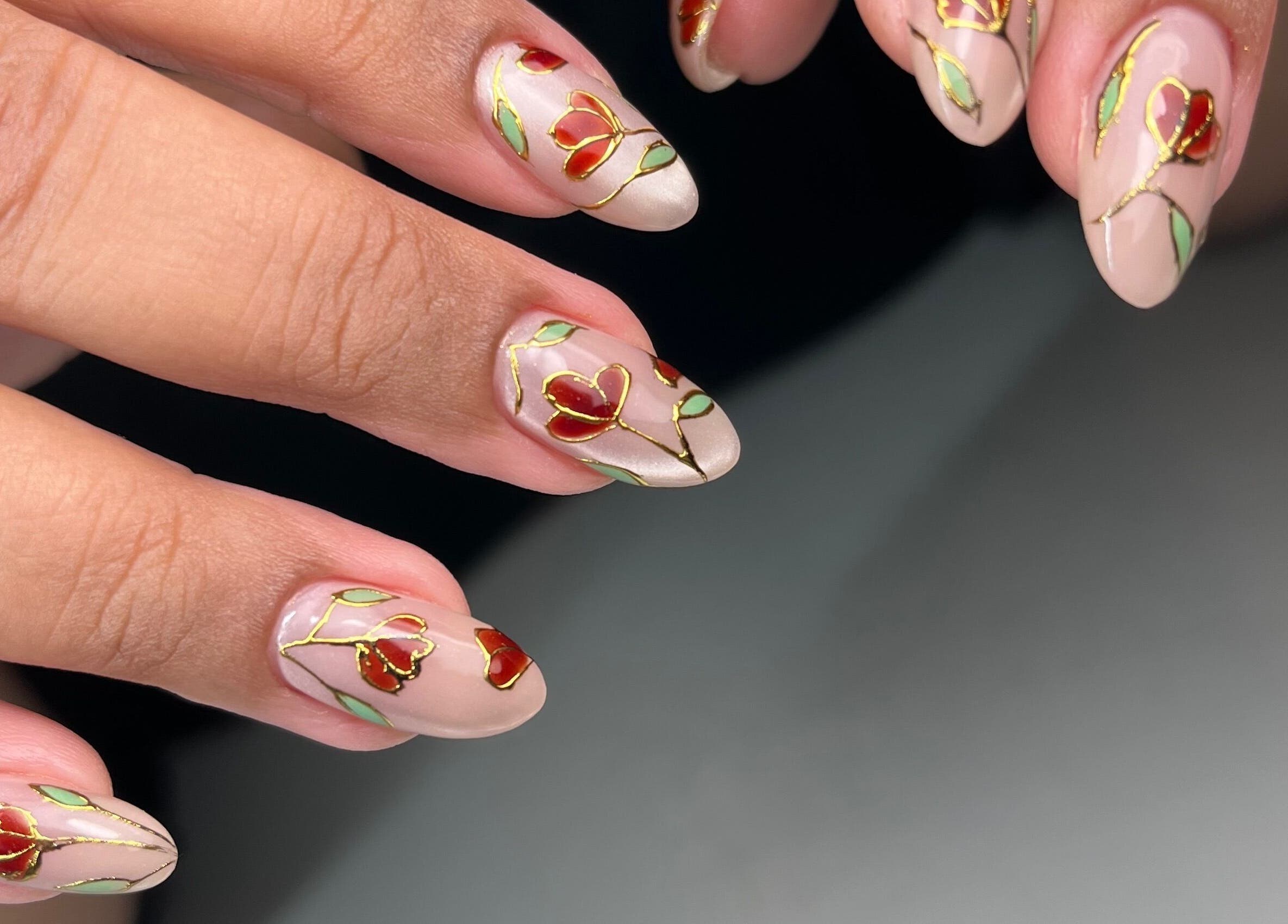 Intricate floral nail art at Dainty Daggers Salon in Calgary, Alberta, CA, showcasing elegance and precision.