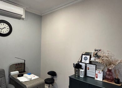 Cozy corner at Gabrielle Elle Nails within Viauty Fulham, London, England, GB with decor and a work station.