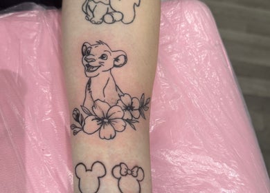 Cub and flowers tattoo at Blissa Beauty Tattoo & SPMU, Bridlington, England, GB. Delicate line art and floral design.