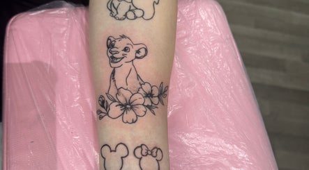 Cub and flowers tattoo at Blissa Beauty Tattoo & SPMU, Bridlington, England, GB. Delicate line art and floral design.