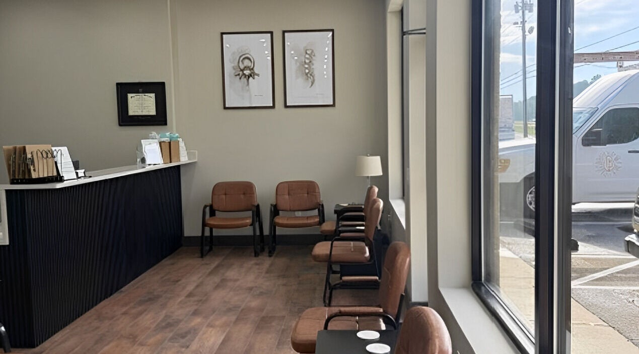 Inviting waiting area at Ashley Durbin, LMT - Vonore in Vonore, Tennessee, US with chairs and natural light.