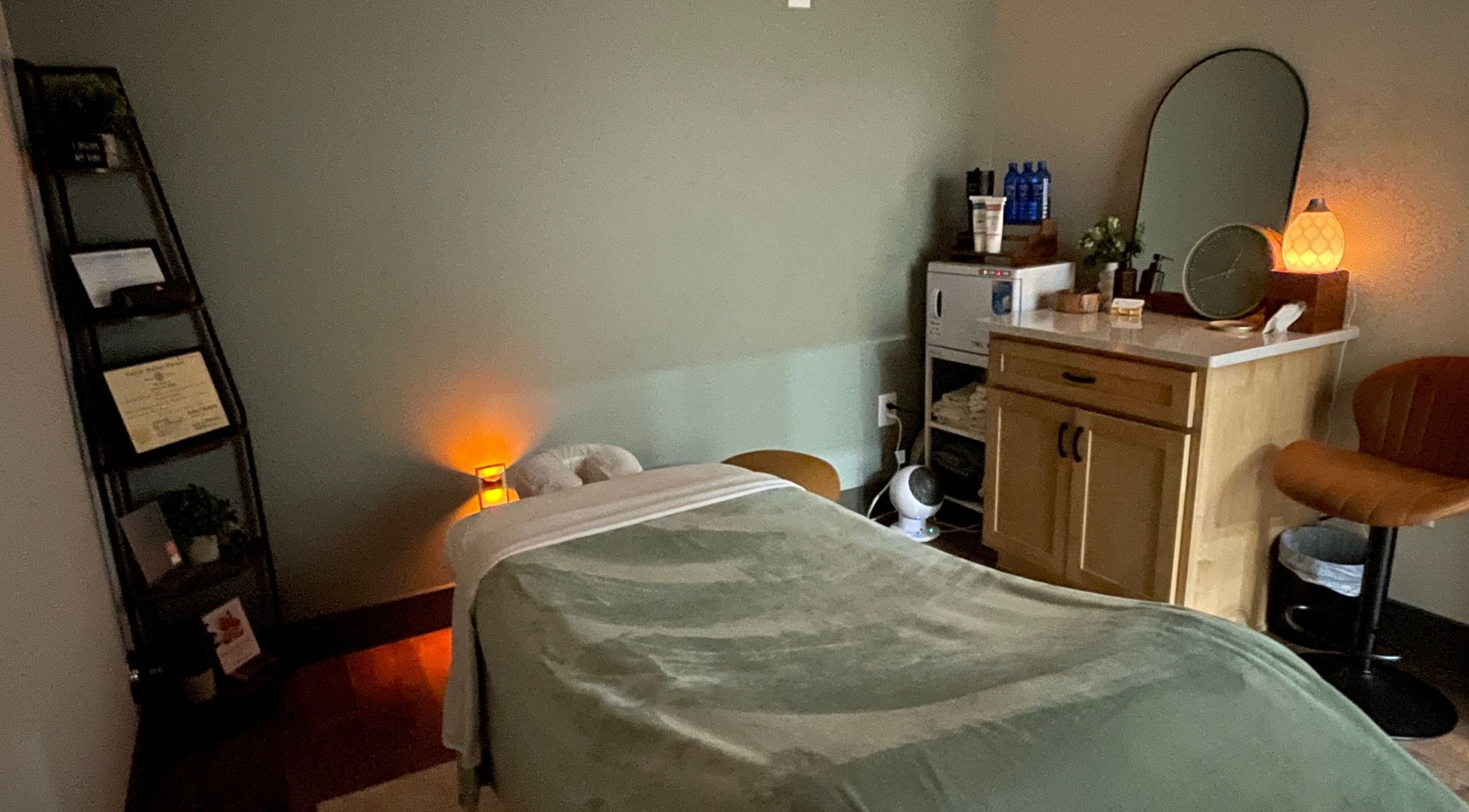 Cozy massage room at Ashley Durbin, LMT - Vonore in Vonore, Tennessee, US with soft lighting and a massage table.