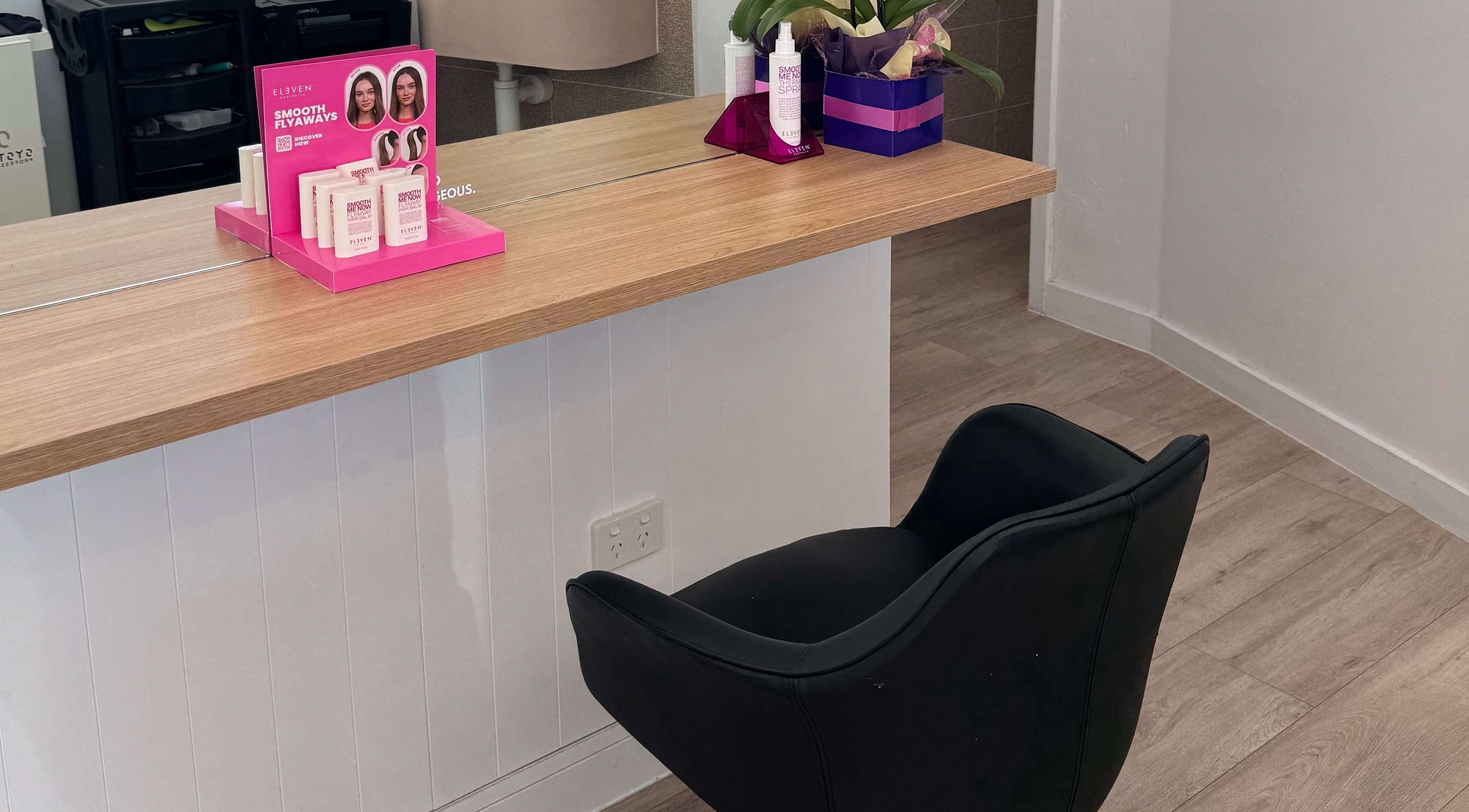 Styling chair and product display at Hair By Simone, Melbourne, Victoria, AU. Elegant salon ambiance captured.