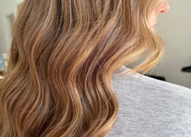 Flowing golden hair at Hair By Simone in Melbourne, Victoria, AU, showcasing expert styling and coloring.