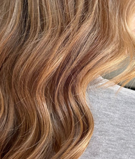 Flowing golden hair at Hair By Simone in Melbourne, Victoria, AU, showcasing expert styling and coloring.