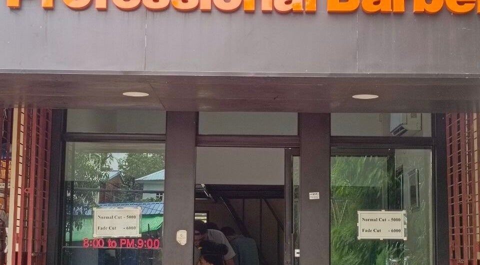 Exterior view of Point (north dagon) barber shop, Yangon, Yangon Region, MM with visible service pricing.