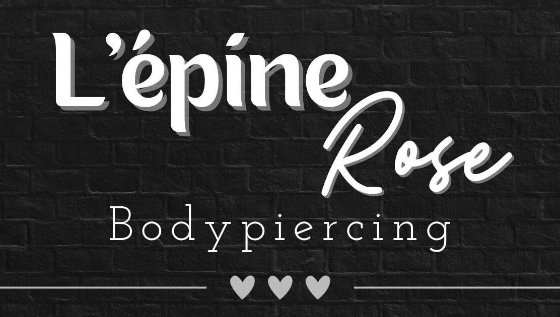 Logo lumineux de L’épine rose | Piercing à Bruille-saint-amand, Hauts-de-france, FR sur fond noir.